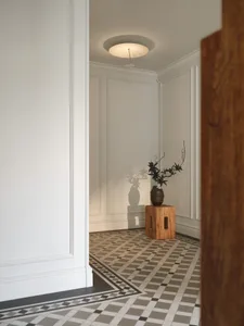 Entrance featuring modern minimalist design with tiled floor and wooden elements.