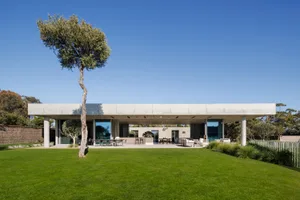 A modern residential building constructed with concrete materials.