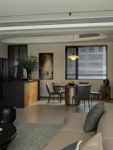 Modern interior design featuring a roadside-themed grey sofa and a mix of materials.