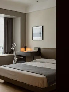 Modern minimalist bedroom with black-framed floating desk, beige bedding, and a floating shelf.