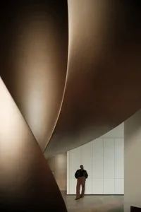 Modern architectural design featuring concrete structures in an urban environment.
