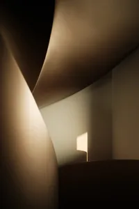 Modern interior design featuring neutral lighting and materials.