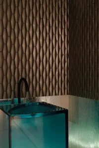 A modern luxury bathroom with a glass tile wall pattern.