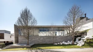 Modern house exterior with concrete walls and minimalist design.