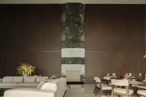 Contemporary living and dining areas with wooden furnishings and marble accents