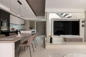 Minimalist living room featuring marble finishes and sleek, contemporary design.