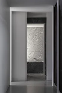 Modern minimalist interior design featuring marble walls and flooring