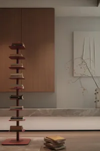 Minimalist interior design featuring a metal floor stack and wooden cabinets