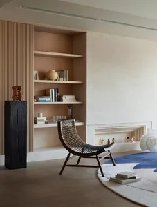 A modern residential interior featuring wood, leather, and ceramic elements.