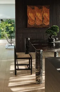 Modern living room with marble furniture and minimalist design.