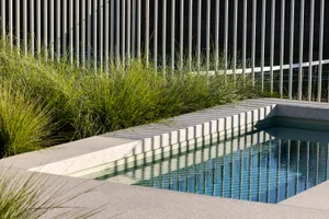 Modern sculpture with concrete surface and geometric, linear design elements