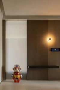 A modern residential entryway featuring wooden paneling.