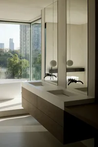 Modern minimalist bathroom featuring a white bathtub, wooden countertop with double sinks, and large glass windows overlookin