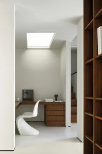 An image depicting a stylish, modern minimalist home office with wooden furniture