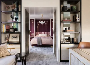 Modern, purple-themed bedroom suite with a chandelier, bed, and bookshelves.