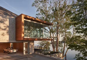 Modern residential building with wood and glass exterior.