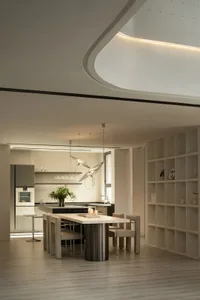A modern residential kitchen featuring metallic and marble finishes, with a central island and minimalist design.
