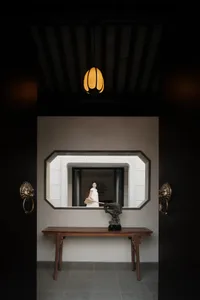 A traditional lobby featuring glass and wooden elements.