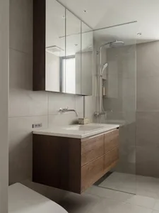 Modern bathroom with concrete walls and floor, minimalist design, and floating vanity