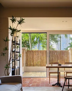 Modern interior design featuring a bamboo fence and natural materials.