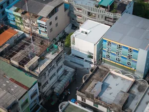 Residential buildings with concrete and metal roofing structures