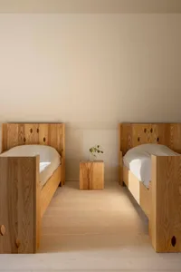 Minimalist bedroom with wood furniture and natural light