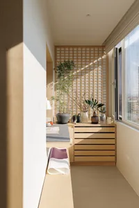 A modern interior work station featuring wooden shelves and minimalist design.