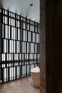 A modern bathroom featuring metal light fixtures
