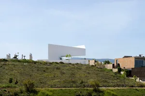 A modern, angular building made of concrete material.