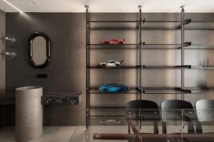 Modern interior design featuring metal shelves displaying toy cars.