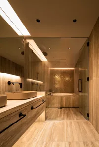 Modern minimalist bathroom with tile flooring and walls, featuring a walk-in shower and a freestanding bathtub.