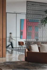 A modern office space featuring a mix of concrete, patterns, and textures.