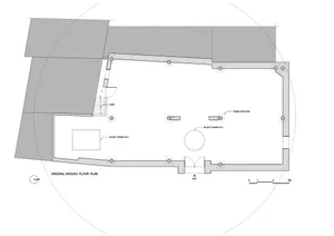 An architectural plan for a building's ground floor, showing layout and structural components like stairs, windows, and doorw