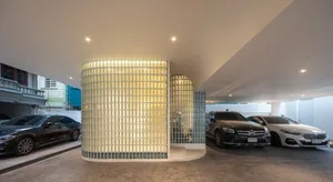 A modern car parking area with glass block walls.