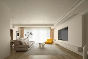 A modern living room with white furniture, wooden flooring, and a minimalist design