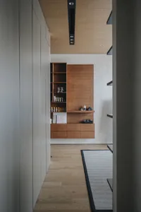 Modern minimalist interior with a wooden wardrobe and minimalist design.