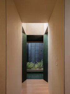 Minimalist interior design featuring wooden panels and sleek, clean lines.
