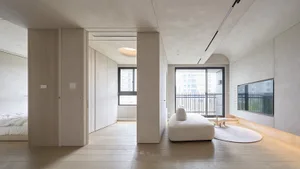 Modern minimalist living room with concrete and wood elements