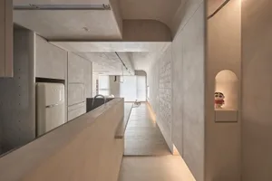 Modern residential interior with minimalist design and concrete walls.