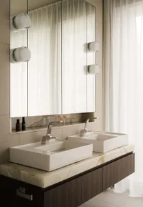 Modern minimalist bathroom featuring a floating vanity with marble countertop and double sinks, surrounded by light-colored w