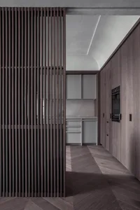 A modern, minimalist kitchen with wooden cabinets and a sleek, contemporary design.