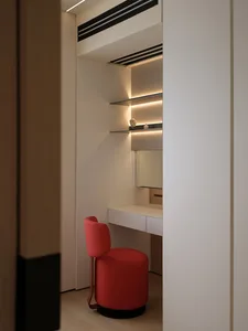 Modern interior wardrobe with neutral tones and minimalist design features.