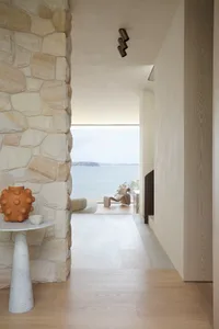 A modern residential space featuring stone and wood elements.