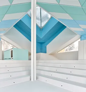 A modern interior design featuring a white metallic space with geometric architectural elements.