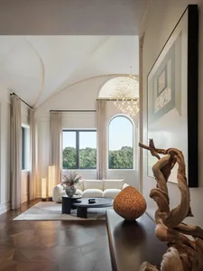 Contemporary living room featuring a large window with an arched design, white sofas, a round coffee table, and a wooden scul