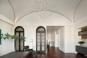 A retro-style living room with wooden and glass furnishings