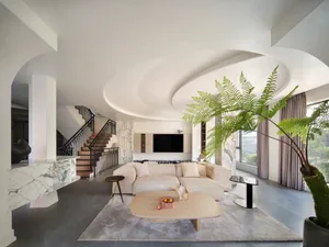 Modern living room featuring marble and concrete materials with a large sofa and coffee table.