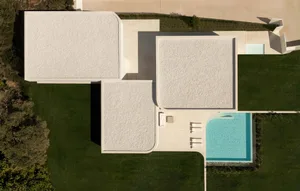 Aerial view of modern residential architecture featuring a concrete floor plan.