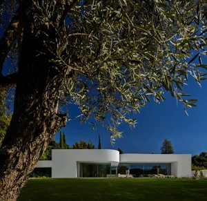 A modern residential exterior with a white exterior design.
