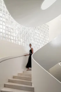 A modern interior design featuring concrete and geometric shapes.